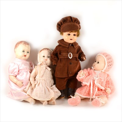 Lot 121 - Three early plastic dolls and a bisque head doll, including an Armand Marseille 996 head stamp with sleepy eyes, open mouth and composition body, in a boys outfit.