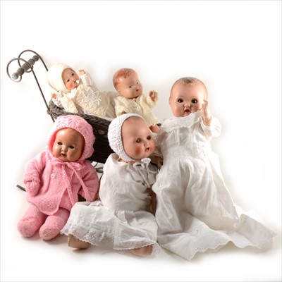 Lot 144 - Five composition baby dolls, and a small sledge.