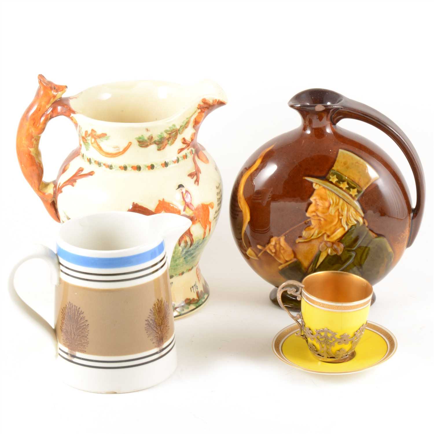 Lot 74 - A Mocha ware jug, John Peel jug, Dewar's whisky ewer by DOulton, and a Worcester coffee can and saucer.