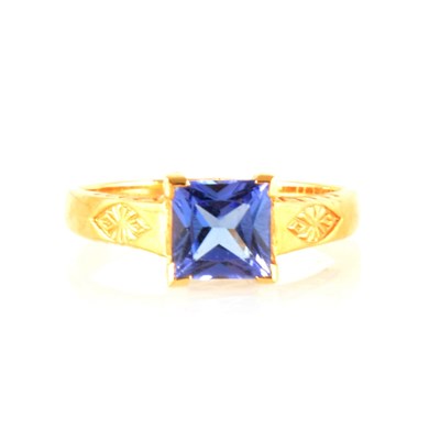 Lot 213 - A princess cut tanzanite ring.