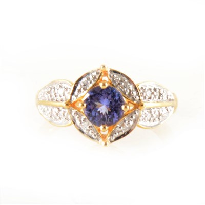 Lot 157 - A tanzanite and diamond cluster ring.