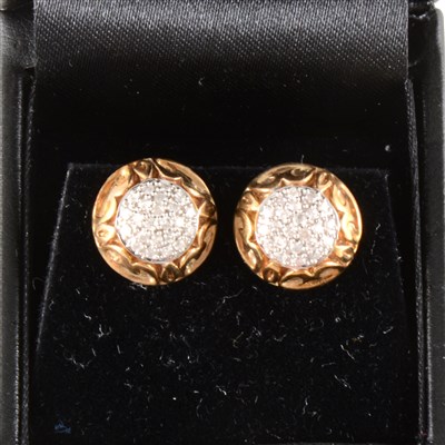 Lot 238 - A pair of circular diamond cluster earrings in 9 carat yellow gold mounts.