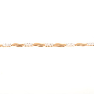 Lot 242 - A diamond line bracelet.