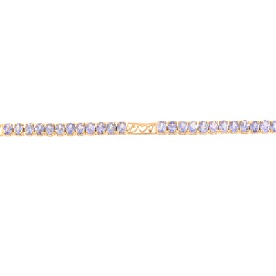 Lot 241 - A tanzanite line bracelet.