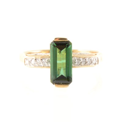 Lot 222A - A green tourmaline and diamond dress ring.