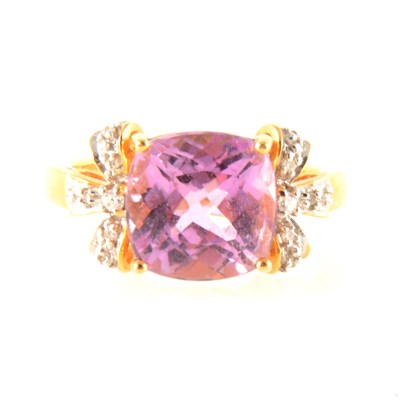 Lot 215 - A pink kunzite and diamond dress ring.