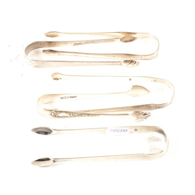 Lot 164 - Four pairs of silver sugar tongs, plus a plated pair.