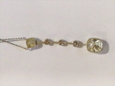 Lot 684 - A diamond set drop pendant with two antique cushion cut diamonds and three old cut diamonds.