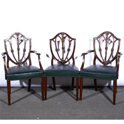 Lot 342 - A set of eight Hepplewhite style mahogany and stained wood shield-back dining chairs, ...