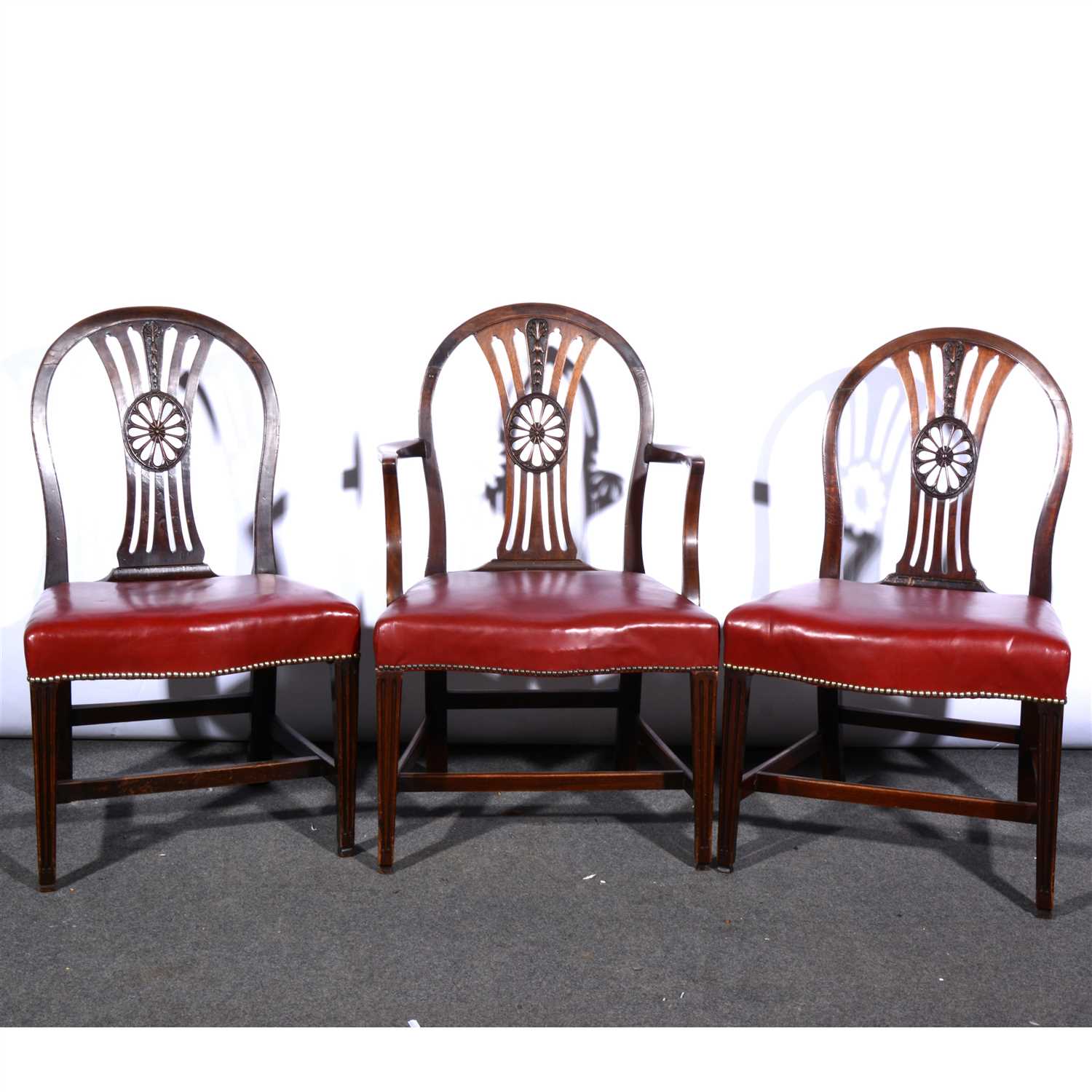 Lot 385 - A Harlequin set of ten mahogany and stained wood Hepplewhite style dining chairs, ...