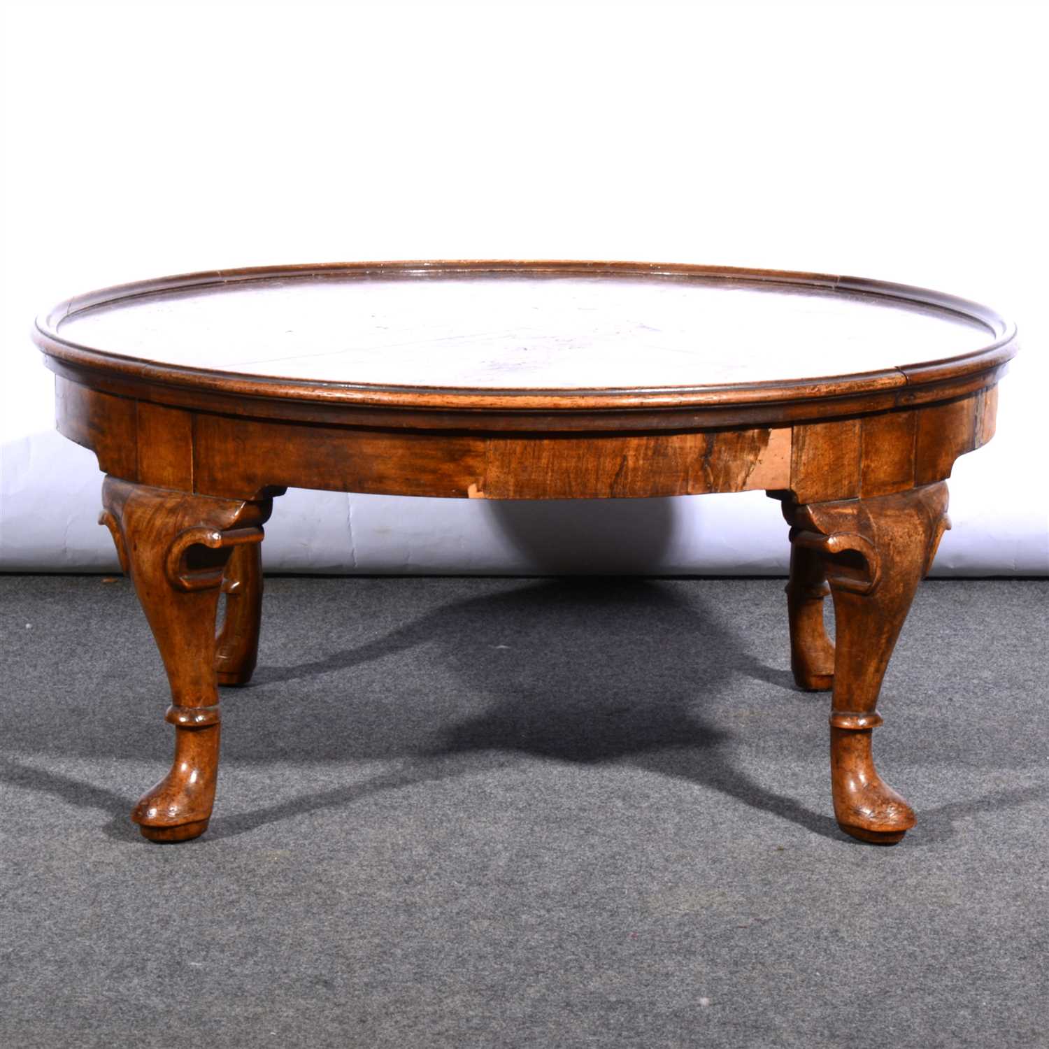 Lot 402 A walnut finish coffee table,