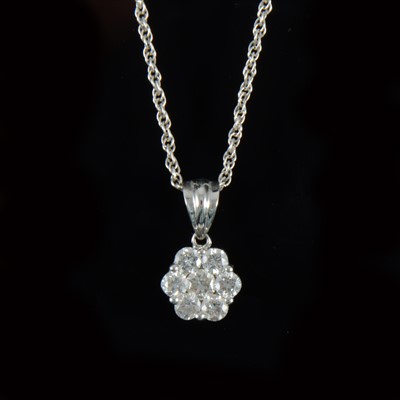 Lot 310 - A diamond cluster pendant and chain.