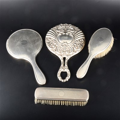Lot 107 - A matched set of silver backed engine turned mirror and two brushes, ...