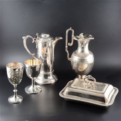 Lot 53 - A silver-plated claret jug, engraved with a chariot scene, ...