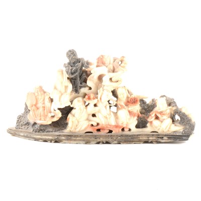 Lot 85 - A Chinese carved soap stone group, figures amongst clouds.
