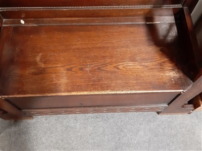 Lot 393 - An oak hall stand, bevelled mirror back, ...