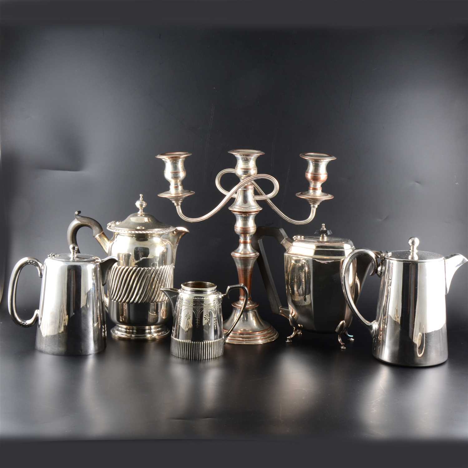 Lot 51 - A quantity of silver-plated, pewter and brass items, including three tankards engraved "Angel Hotel Kettering"