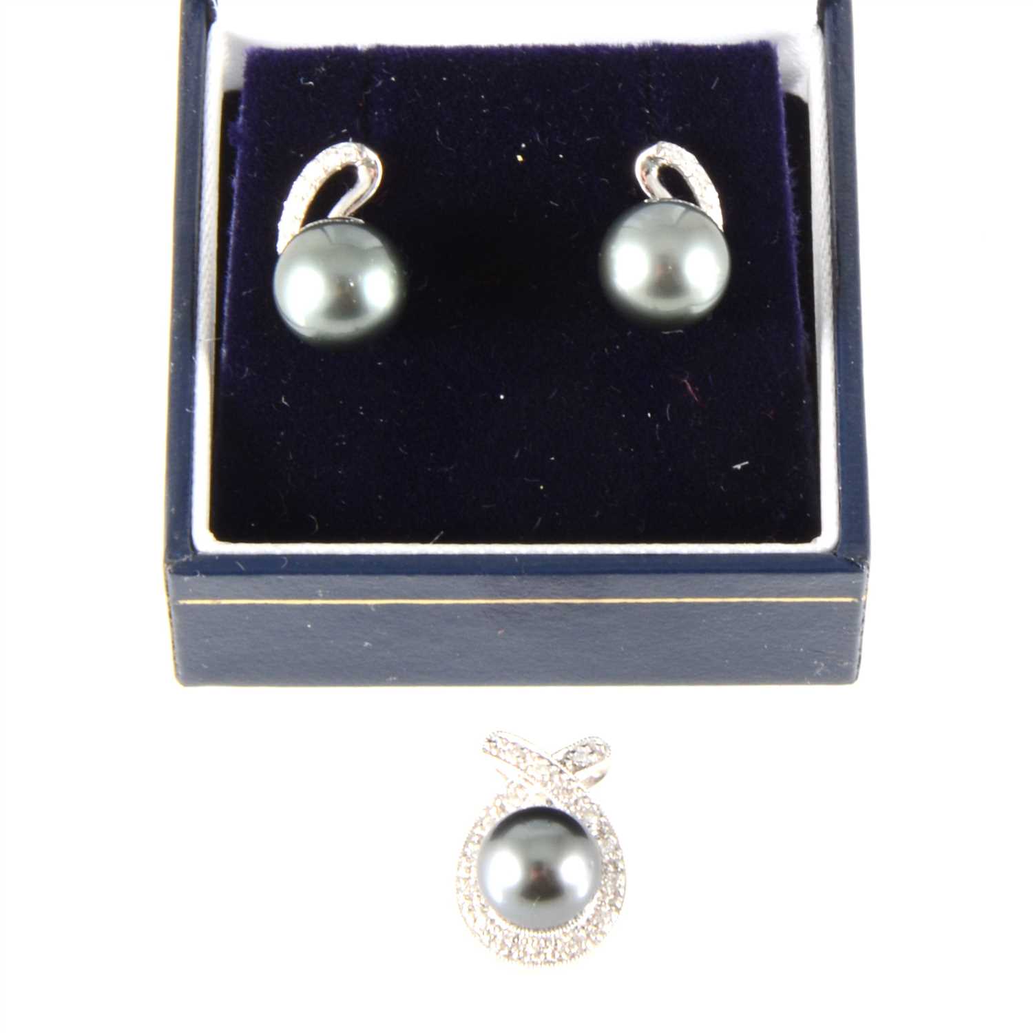 Lot 185 - A Japanese Akoya pearl and diamond pendant and a pair of Tahitian and diamond drop earrings.