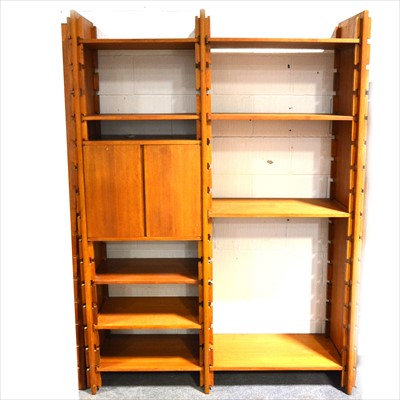 Lot 633 - A hardwood sectional wall unit