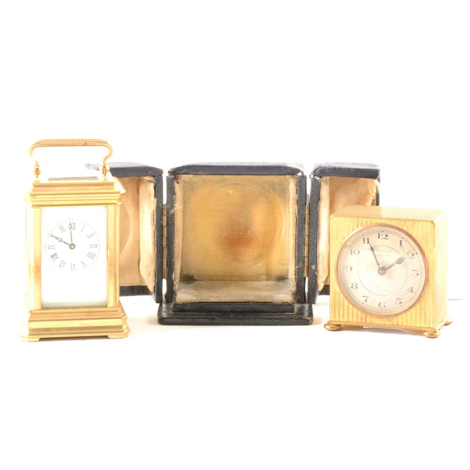 Lot 99 - A miniature brass carriage clock, and a Zenith travel alarm