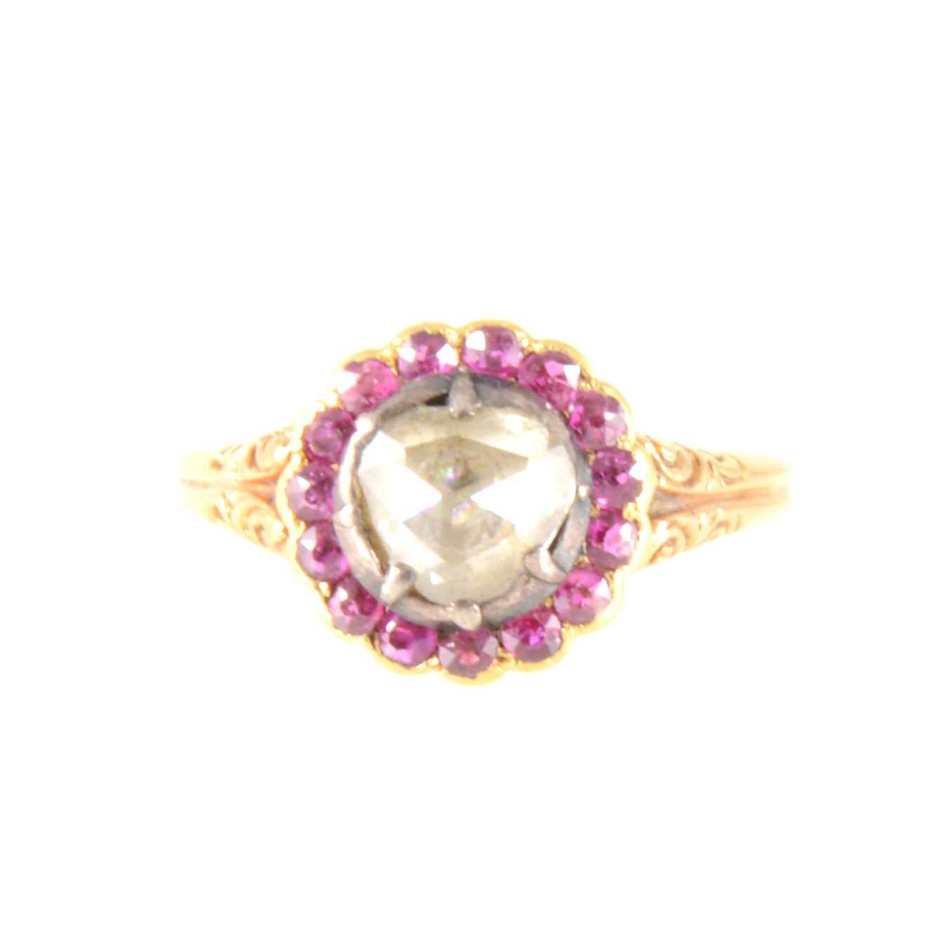 Lot 141 - An old rose cut diamond and pink stone cluster ring.
