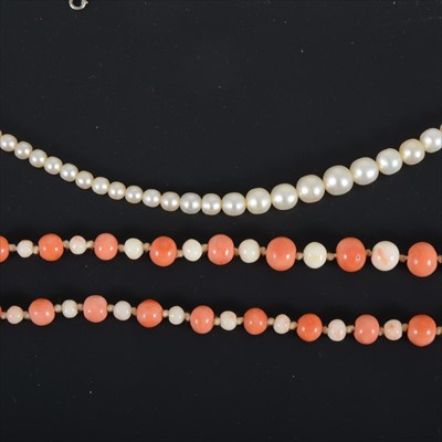 Lot 325 - A coral necklace and a simulated pearl necklace.