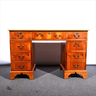 Lot 537 - A reproduction yew wood finish twin pedestal desk, ...