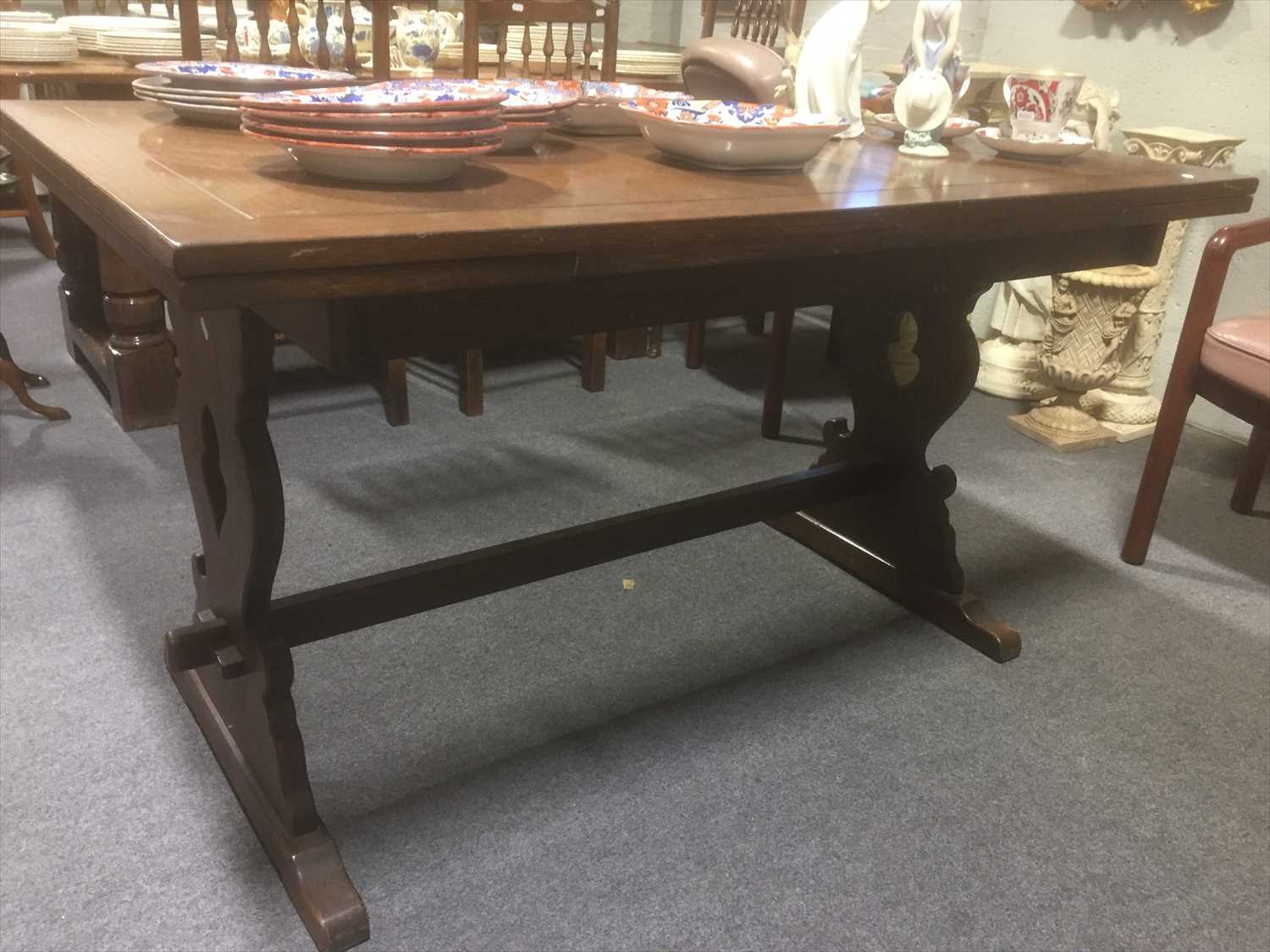 Lot 551 - An oak drawer leaf dining table, ...
