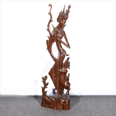 Lot 466 - South-east Asian carved stinkwood figure of a Goddess with a deer