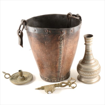 Lot 125 - An old leather fire bucket, candle snuffers, etc