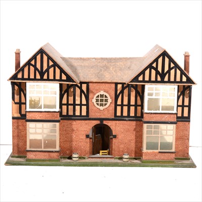 Lot 181 - Doll's house, modelled as a twin gabled villa, with a small quantity of furniture.