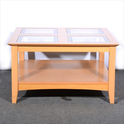 Lot 486 - A contemporary beechwood coffee table, square top with four glass inserts, with an under-tier, 80cm x 80cm.