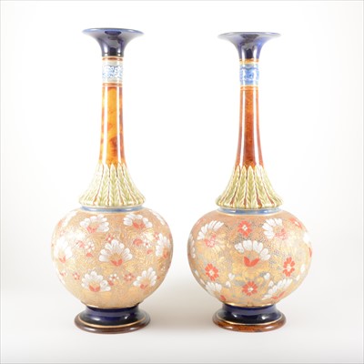 Lot 11 - A pair of tall stoneware bottle vases, by Doulton Lambeth.
