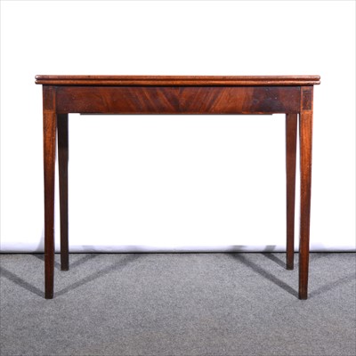 Lot 623 - A George III mahogany foldover tea table, ...