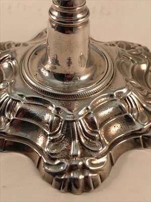 Lot 641 - A pair of George II silver candlesticks