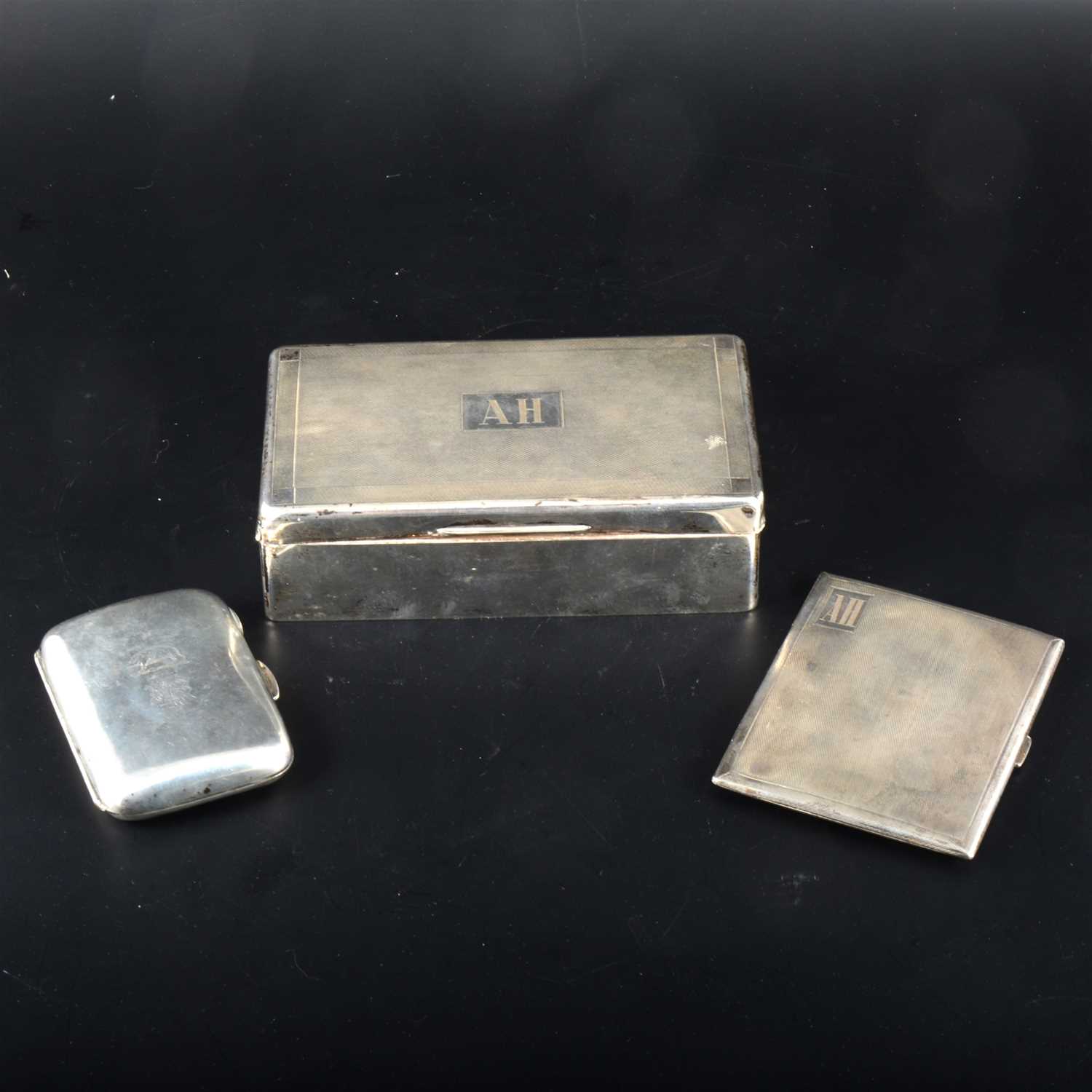 Lot 114 - A silver cigarette box, Alfred Deeley, Birmingham 1933 and two silver cigarette cases.
