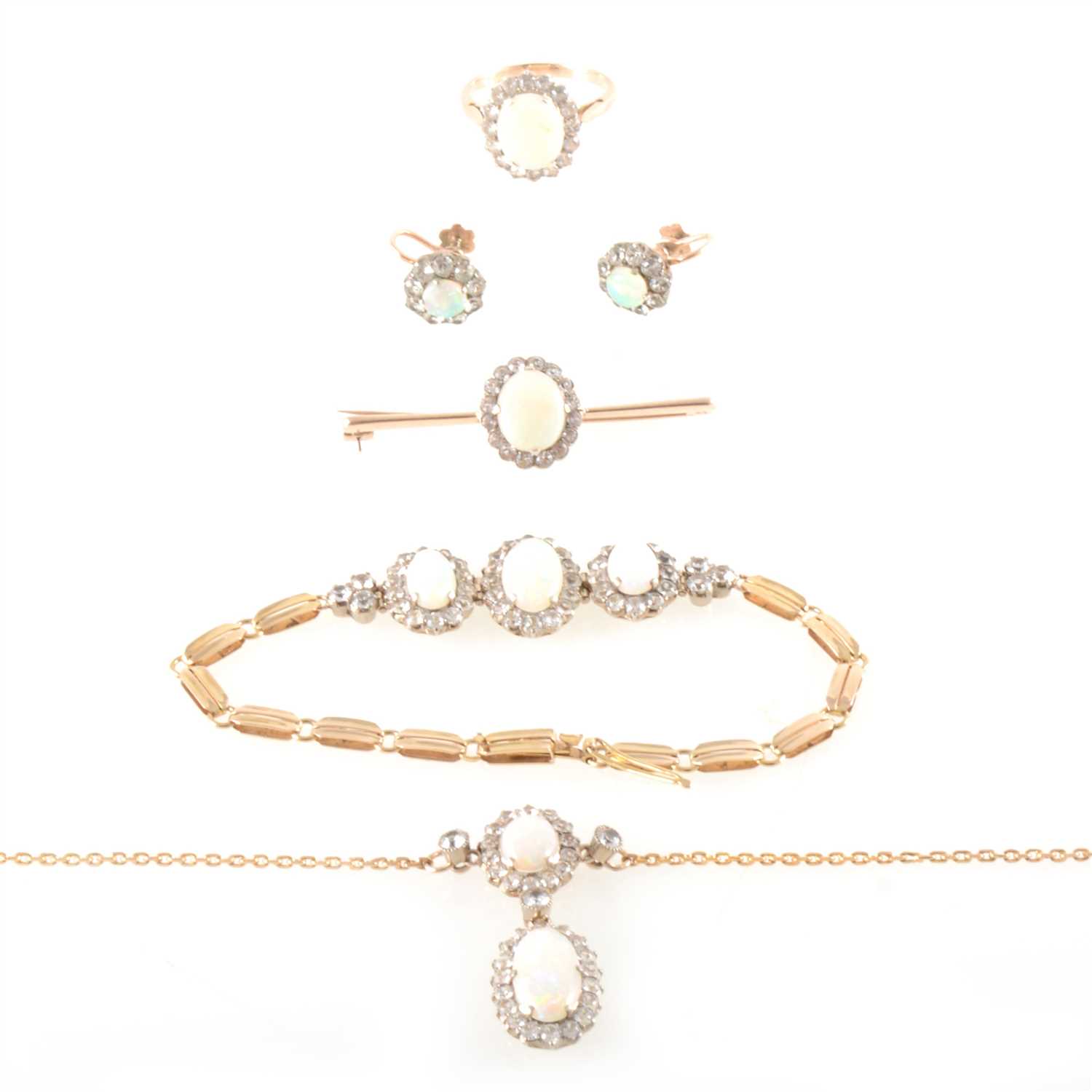 Lot 184 - A suite of opal jewellery - necklace, bracelet, brooch, earrings and ring.
