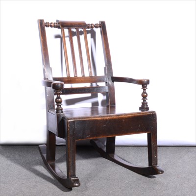 Lot 577 - A Victorian walnut rocking chair, ...