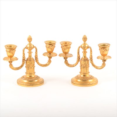 Lot 534 - Pair of Louis XVI style gilt metal two-branch candelabra