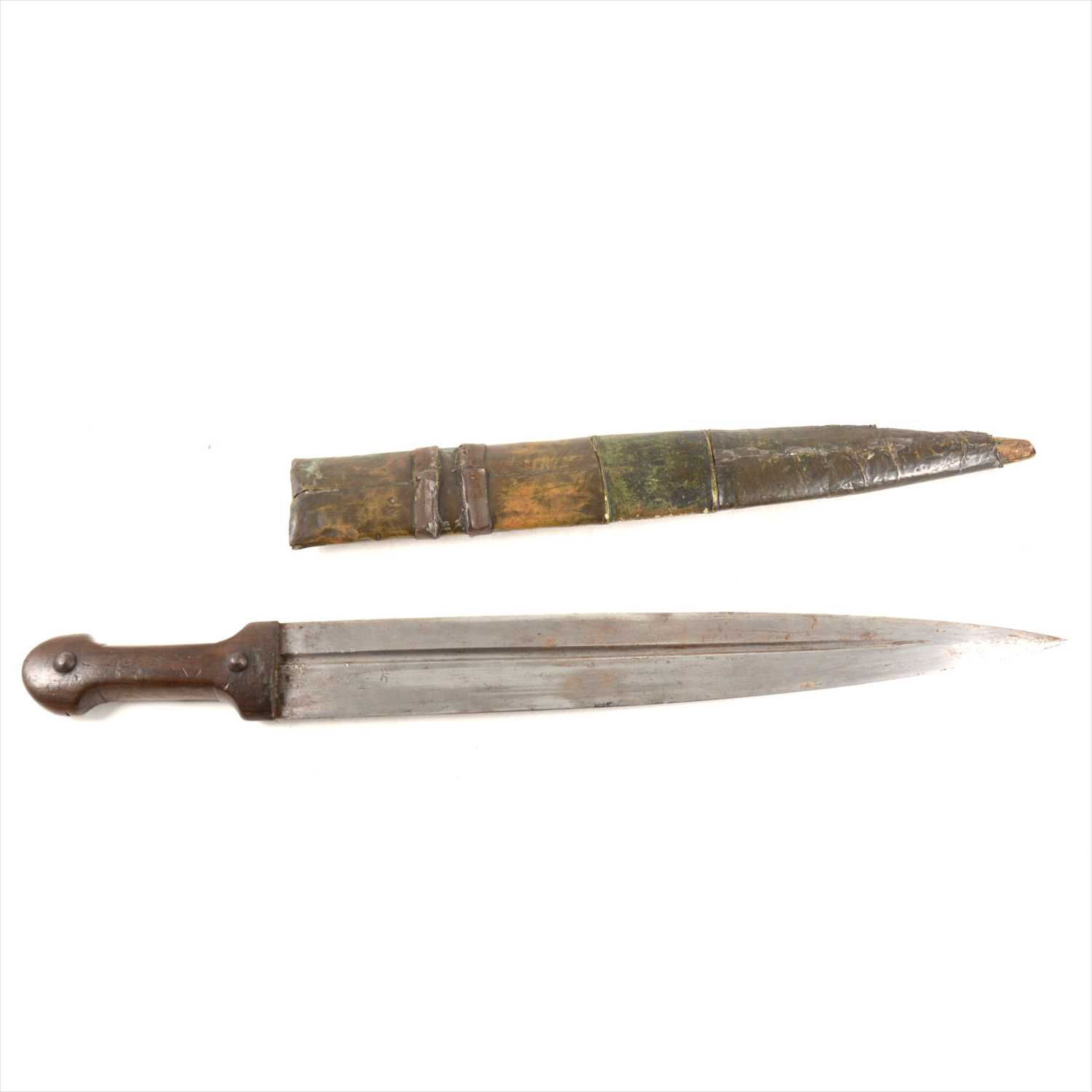 Lot 242 - An North African knife, 41cm fullered blade, in a metal covered sheath.