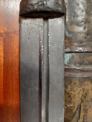 Lot 242 - An North African knife, 41cm fullered blade, in a metal covered sheath.