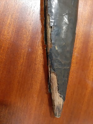 Lot 242 - An North African knife, 41cm fullered blade, in a metal covered sheath.