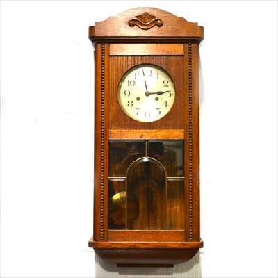 Lot 385 - An oak cased wall clock