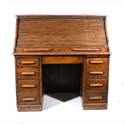 Lot 376 - An oak roll-top desk, tambour front defective