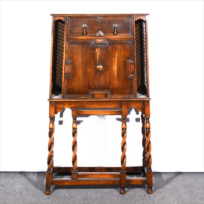 Lot 553 - An oak escritoire, fitted with a single drawer...