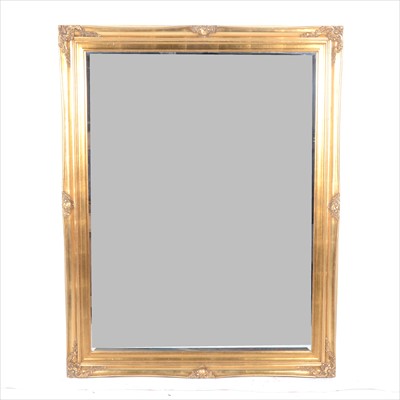 Lot 419 - A modern gilt framed wall mirror, rectangular bevelled plate, 100cm x 142cm.