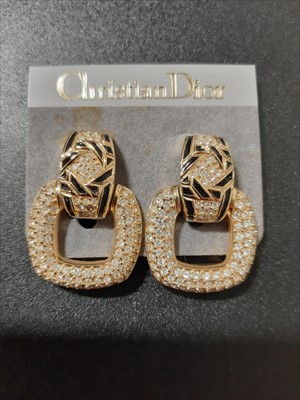 Lot 349 - Christian Dior - a mesh necklace and matching earrings.