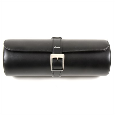 Lot 712 - Must de Cartier - a black cowhide leather roll with fabric interior to hold watches.
