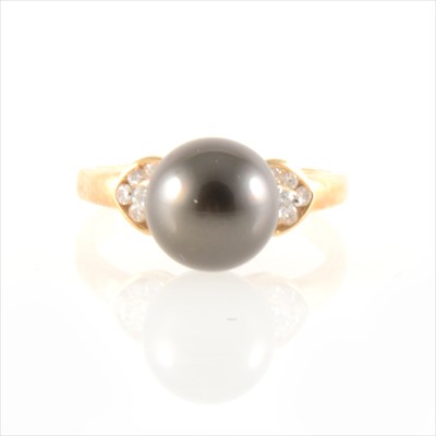 Lot 292 - A Tahitian pearl and diamond ring.