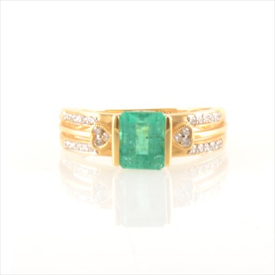 Lot 298 - An emerald and diamond ring.